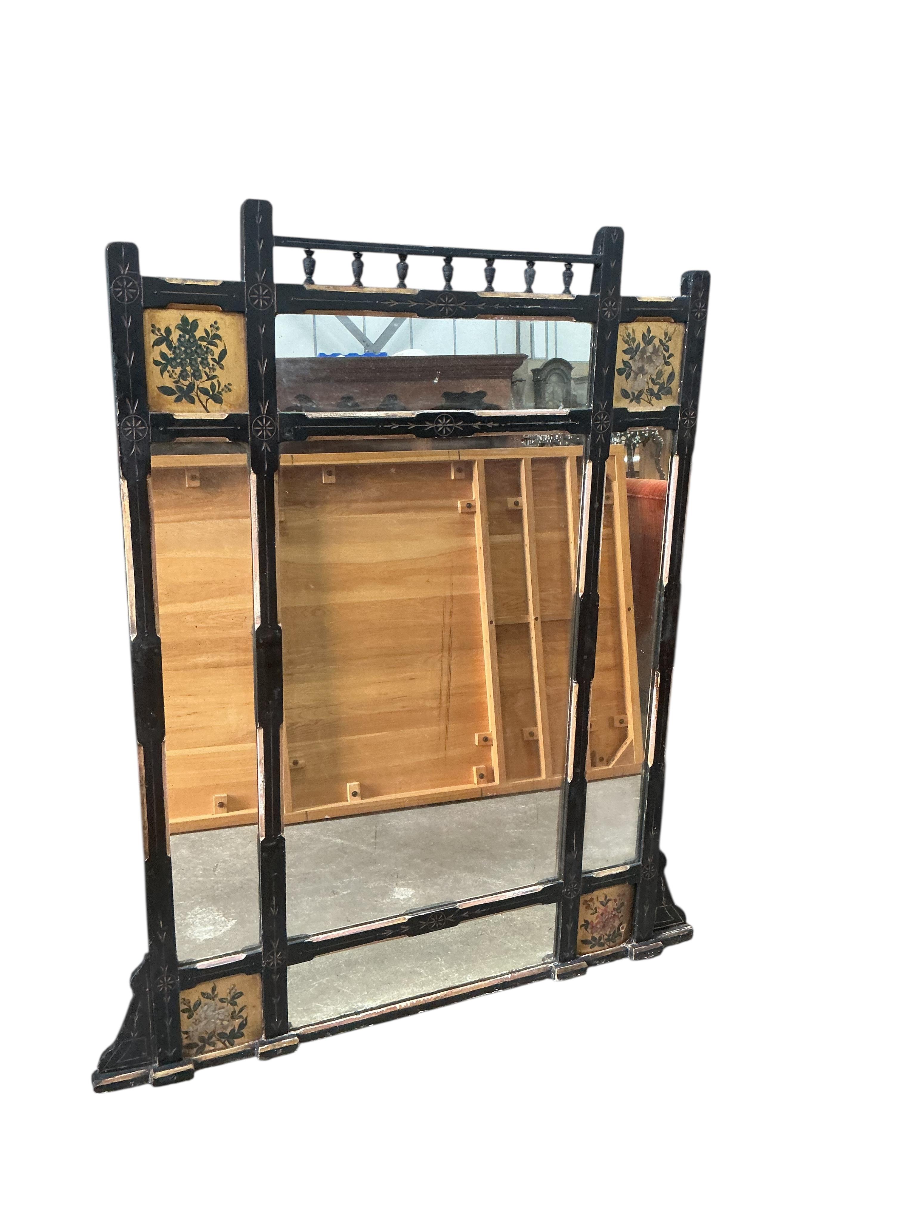 A late Victorian Aesthetic movement part ebonised painted overmantel mirror, width 94cm, height 134cm